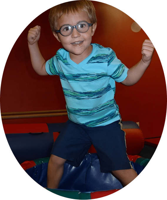 A fitness-conscious young boy with glasses and a blue shirt.